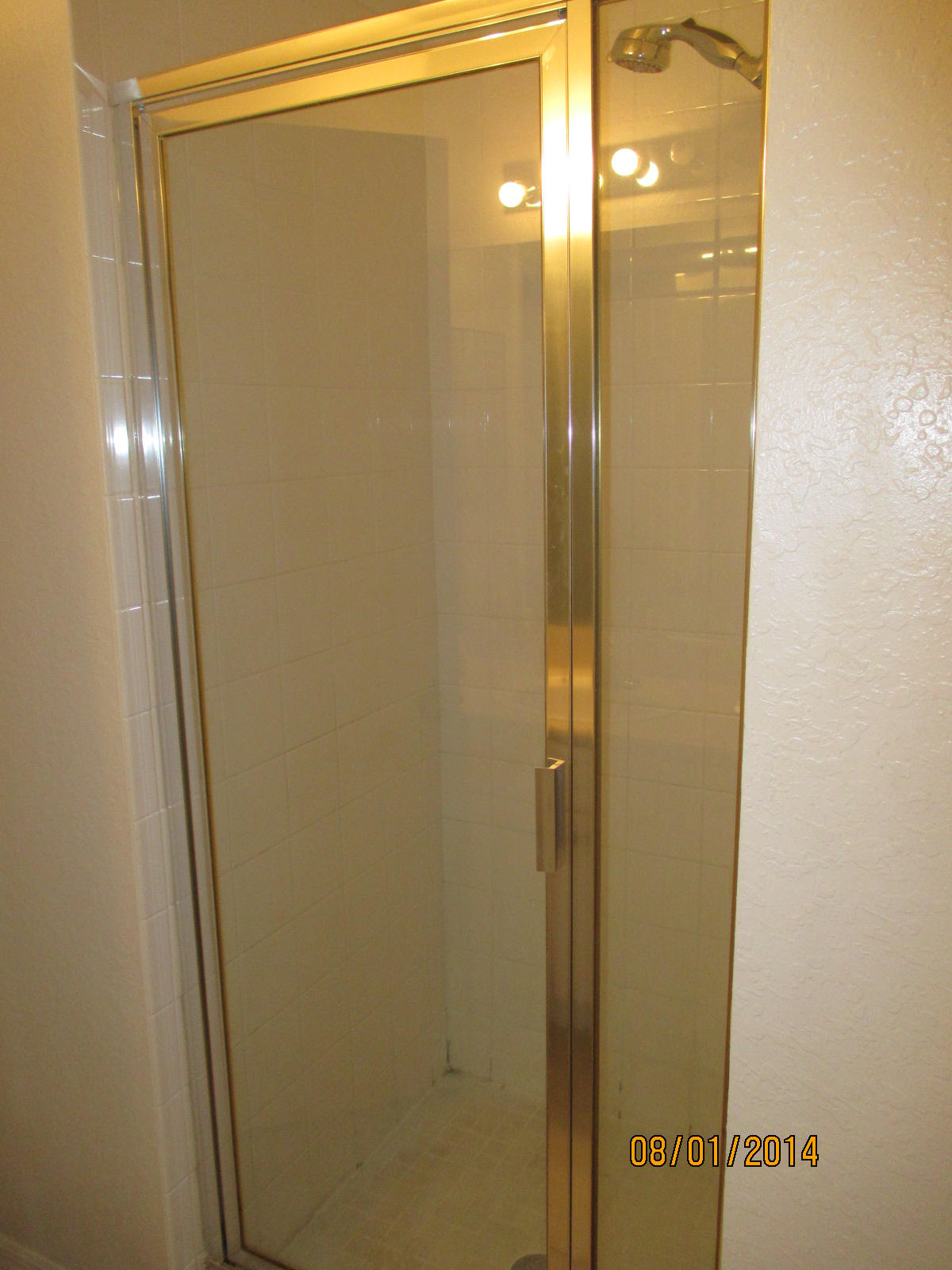 541 Southeast Prescott Place, Unit 541 Stuart, FL 34994 - Photo 15 of 20 a bathroom with a glass shower door