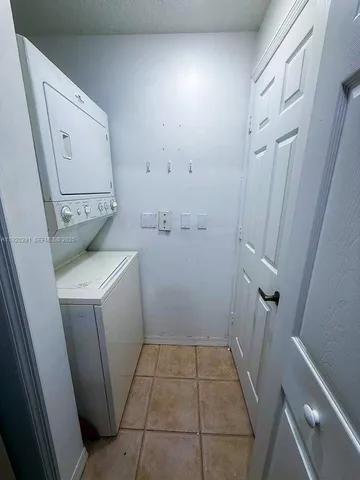 a view of storage and utility room with wooden floor