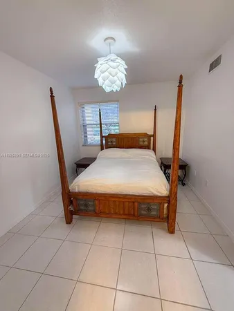 a bedroom with a bed and a table