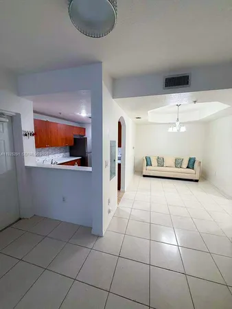 a kitchen with stainless steel appliances a refrigerator and a sink