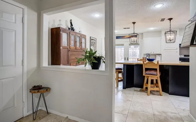 a view of a kitchen with furniture and a window