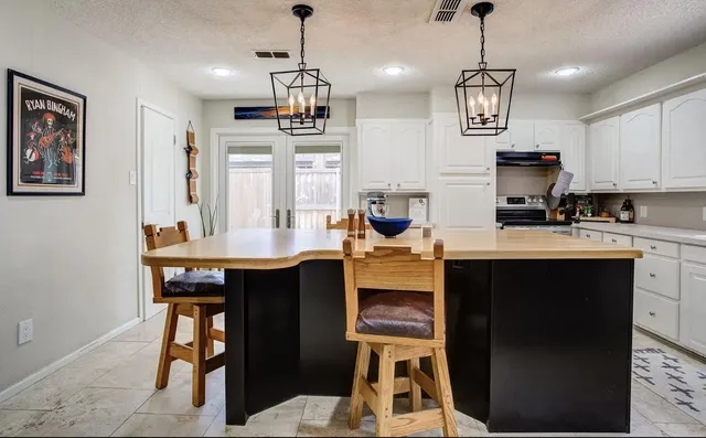a kitchen with a sink cabinets and window