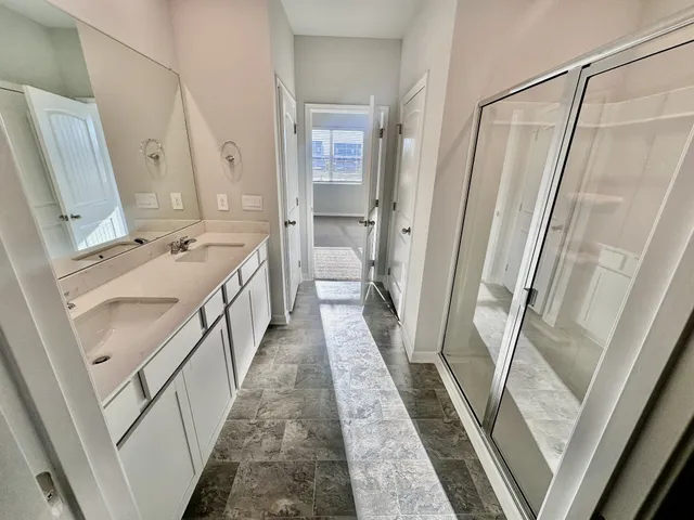 a bathroom with a sink a mirror and a toilet