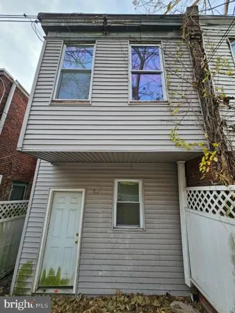 a view of a brick house with a door