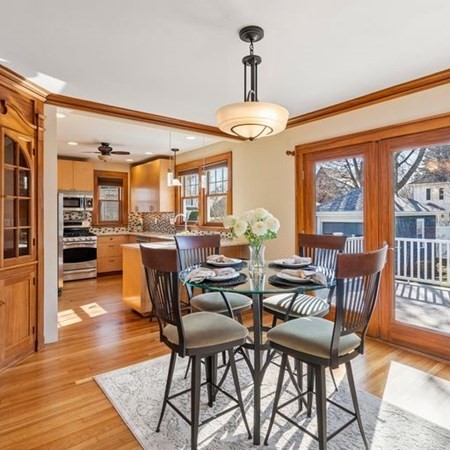 35 Welgate Road Medford, MA 02155 - Photo 15 of 40 a view of a dining room with furniture window and wooden floor