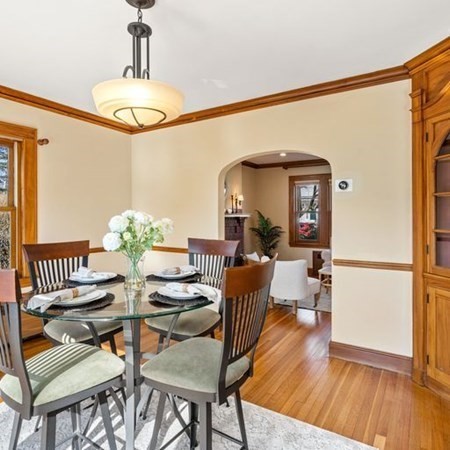 35 Welgate Road Medford, MA 02155 - Photo 16 of 40 a view of a dining room with furniture and wooden floor