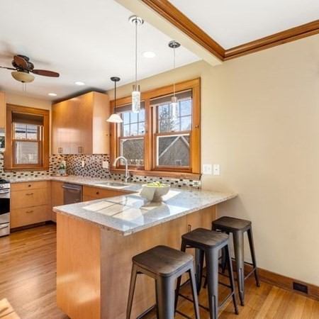 35 Welgate Road Medford, MA 02155 - Photo 18 of 40 a kitchen with a table and chairs in it