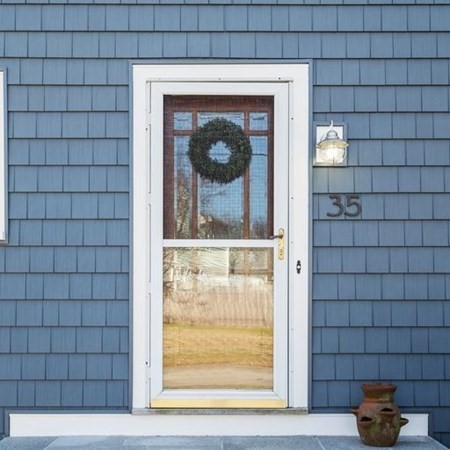 35 Welgate Road Medford, MA 02155 - Photo 2 of 40 a front view of a house with a glass door and a window