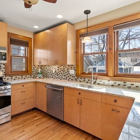 35 Welgate Road Medford, MA 02155 - Photo 21 of 40 a kitchen with stainless steel appliances granite countertop a sink and cabinets