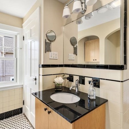 35 Welgate Road Medford, MA 02155 - Photo 27 of 40 a bathroom with a granite countertop sink a mirror and a shower