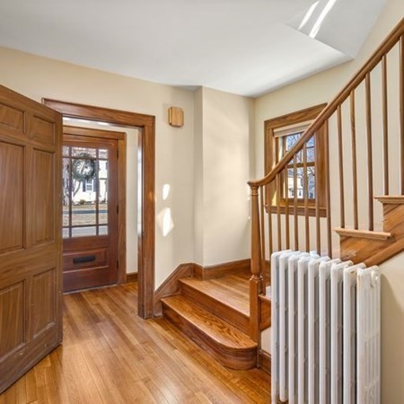 35 Welgate Road Medford, MA 02155 - Photo 6 of 40 a spacious bedroom with a bed and a window