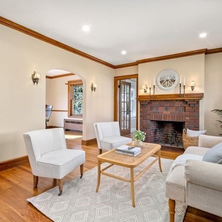 35 Welgate Road Medford, MA 02155 - Photo 10 of 40 a living room with furniture a fireplace and a table
