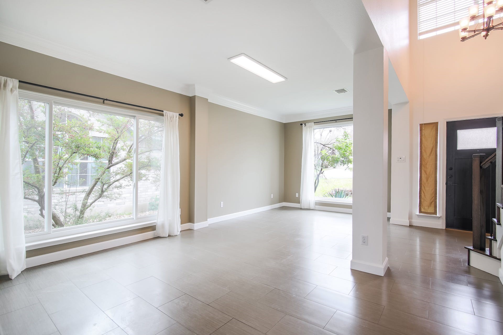 1713 Apache Trail Round Rock, TX 78665 - Photo 11 of 39 a view of an empty room with wooden floor and a window