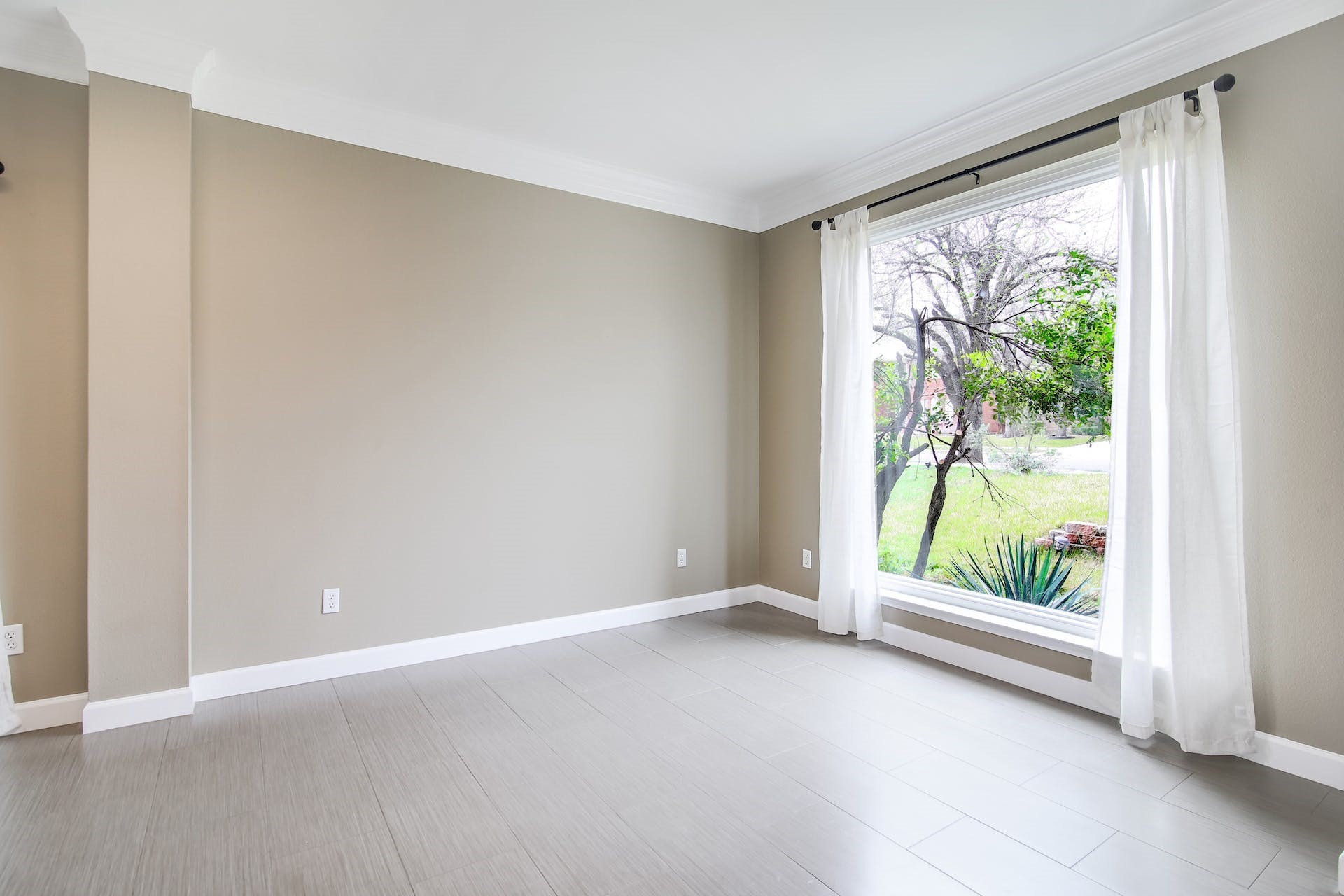 1713 Apache Trail Round Rock, TX 78665 - Photo 13 of 39 a view of an empty room with wooden floor and a window