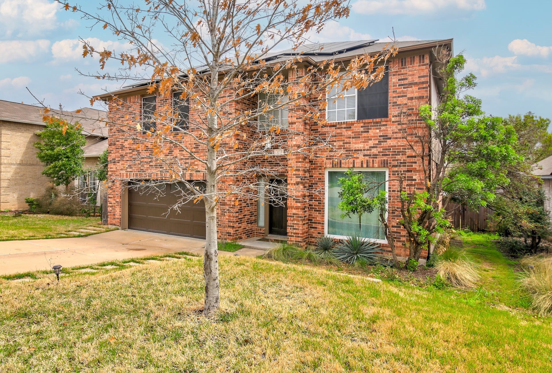 1713 Apache Trail Round Rock, TX 78665 - Photo 2 of 39 a backyard of a house with table and chairs