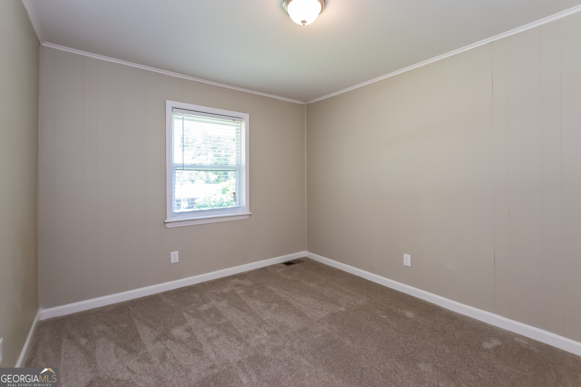 2309 Omaha Road Southwest Atlanta, GA 30331 - Photo 11 of 15 an empty room with a window