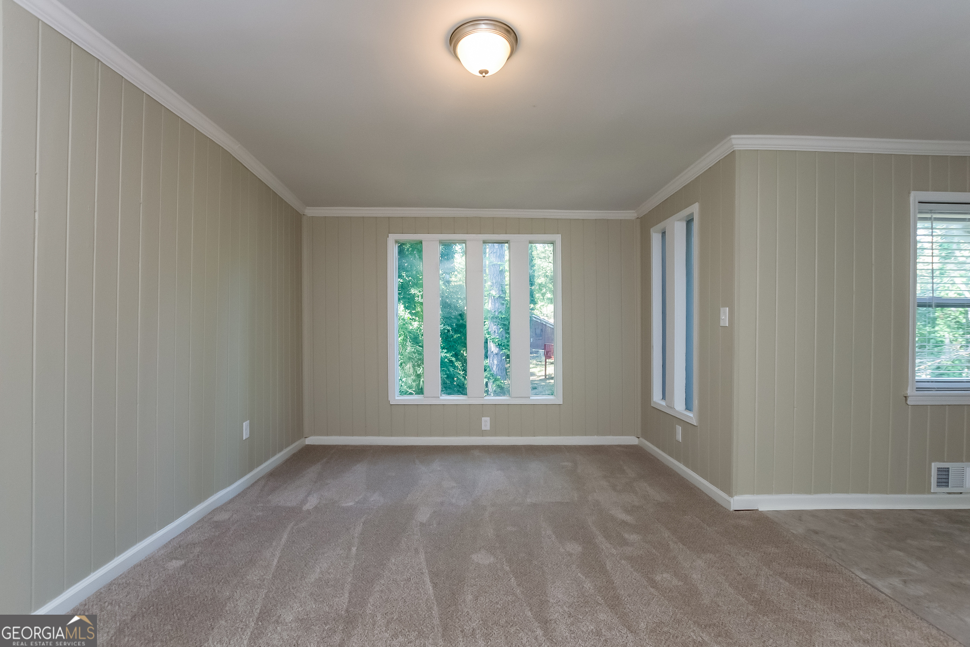 2309 Omaha Road Southwest Atlanta, GA 30331 - Photo 3 of 15 an empty room with windows