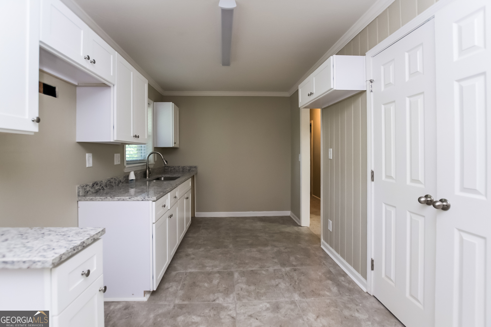 2309 Omaha Road Southwest Atlanta, GA 30331 - Photo 5 of 15 a large kitchen with a sink