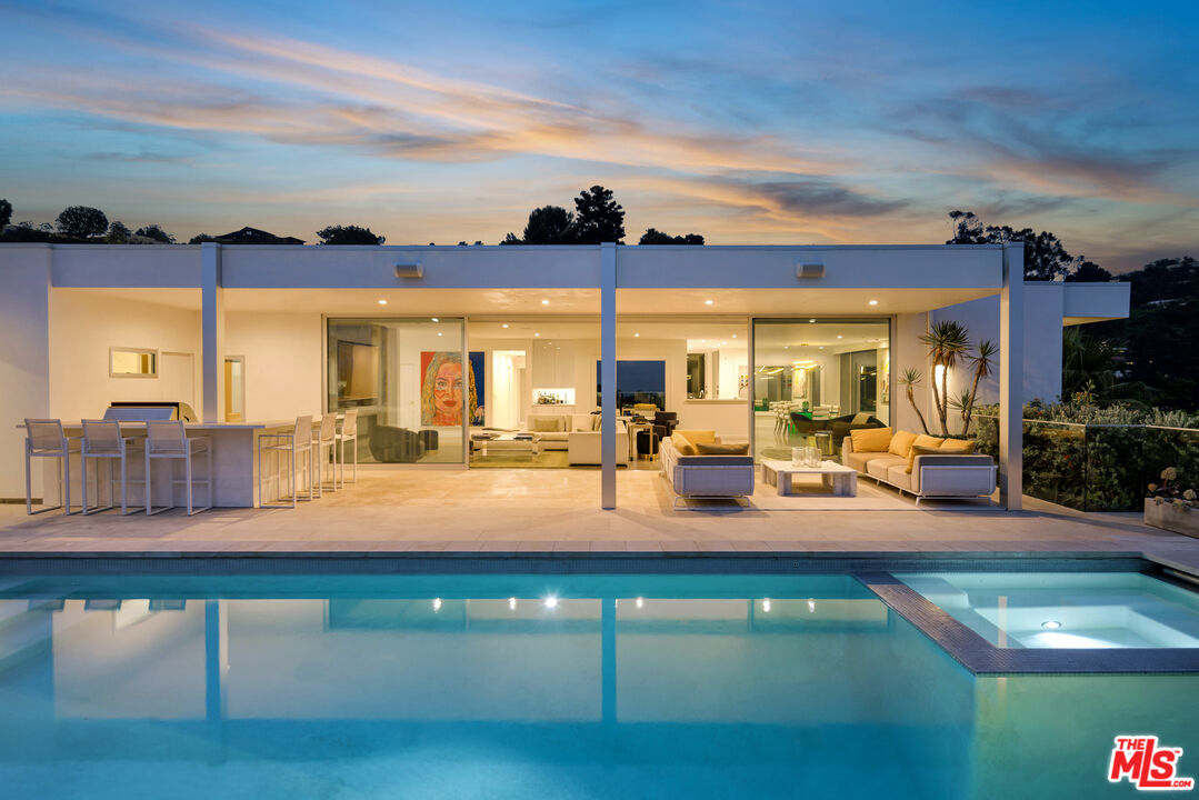 a view of a living room with furniture and chandelier