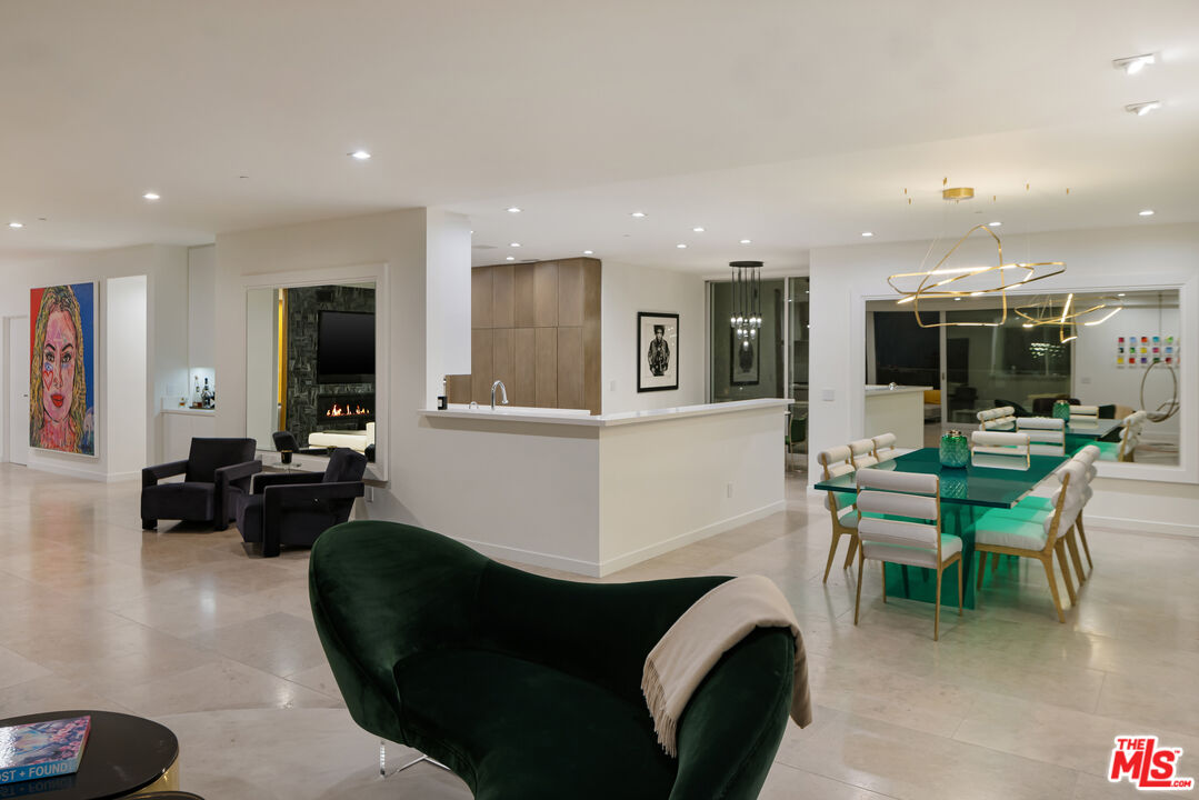 1476 Carla Ridge Beverly Hills, CA 90210 - Photo 4 of 27 a living room with furniture and a flat screen tv