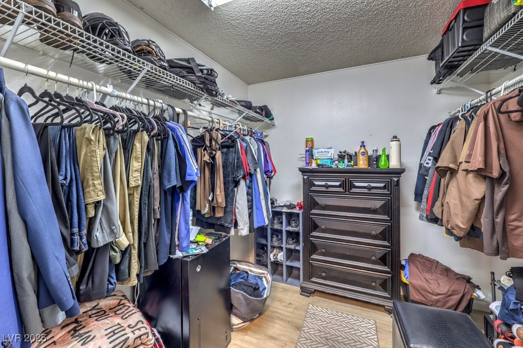2240 Grayson Circle Henderson, NV 89014 - Photo 23 of 38 Walk in closet featuring light wood-style floors