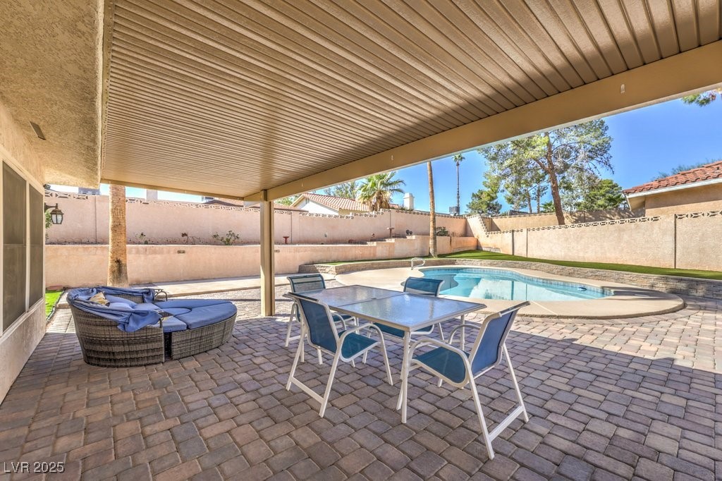 2240 Grayson Circle Henderson, NV 89014 - Photo 30 of 38 Fenced backyard featuring a patio and outdoor dining space
