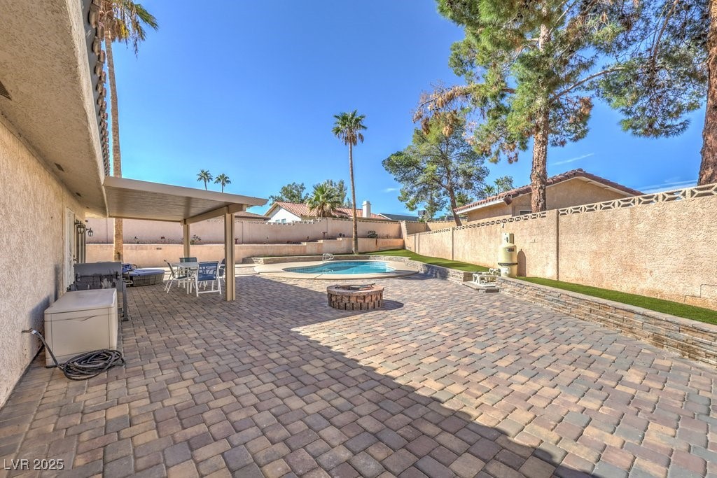 2240 Grayson Circle Henderson, NV 89014 - Photo 31 of 38 Fenced backyard featuring outdoor dining space, a patio, and a jacuzzi