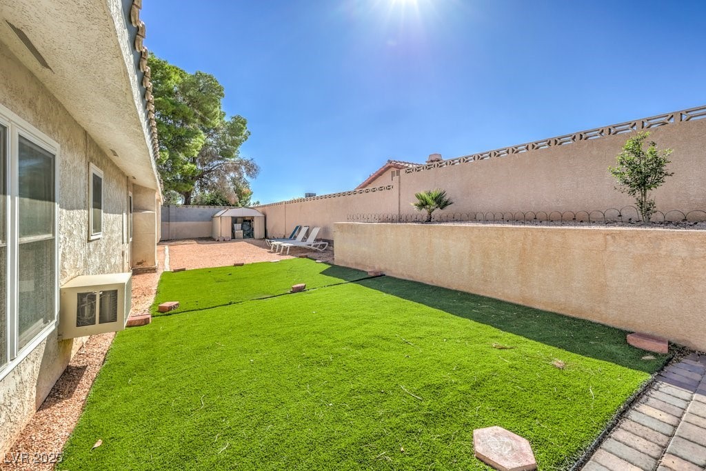 2240 Grayson Circle Henderson, NV 89014 - Photo 35 of 38 Fenced backyard with a shed