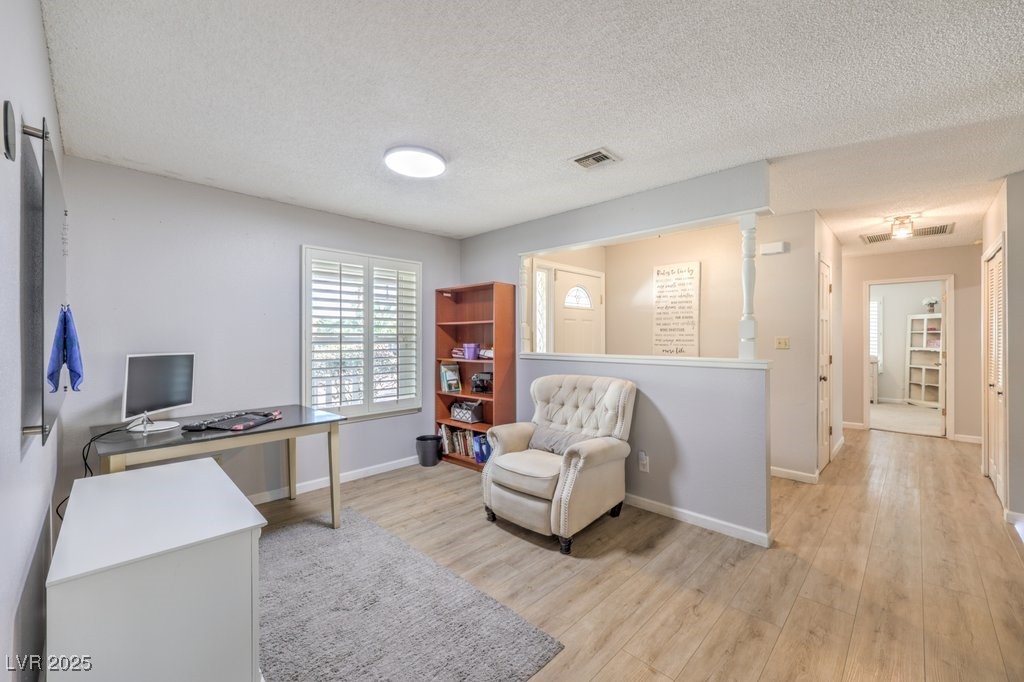2240 Grayson Circle Henderson, NV 89014 - Photo 6 of 38 Office featuring light wood-style flooring and a textured ceiling