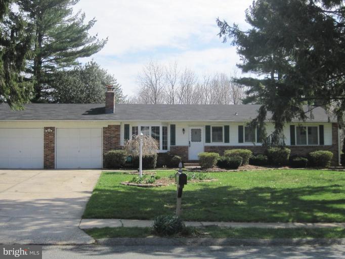 311 Bynum Ridge Road Forest Hill, MD 21050 - Photo 1 of 12 a front view of a house with a yard and garage