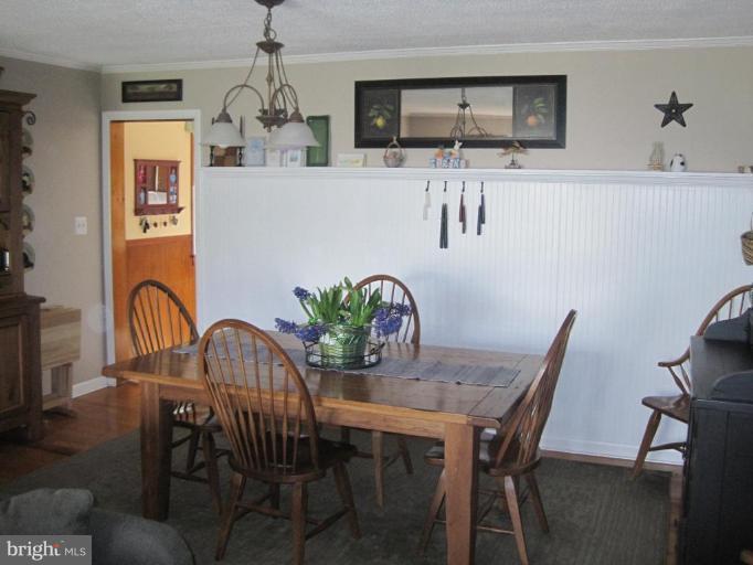 311 Bynum Ridge Road Forest Hill, MD 21050 - Photo 2 of 12 a dining room with furniture and wooden floor