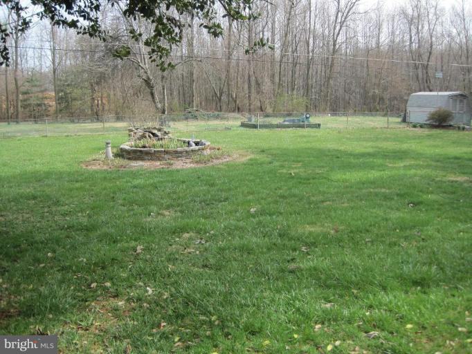 311 Bynum Ridge Road Forest Hill, MD 21050 - Photo 12 of 12 a view of a backyard with table and chairs and wooden fence