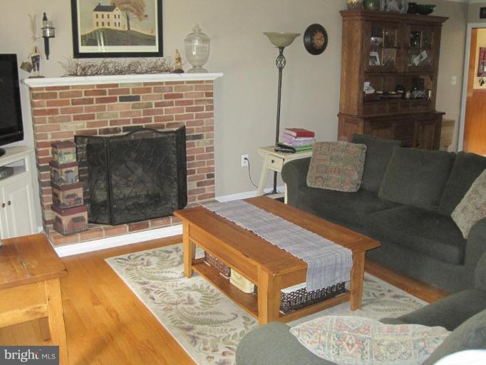 311 Bynum Ridge Road Forest Hill, MD 21050 - Photo 4 of 12 a living room with furniture and a fireplace