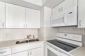 a bathroom with a sink and a washing machine
