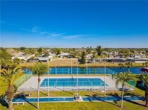 a view of a swimming pool and lounge chairs