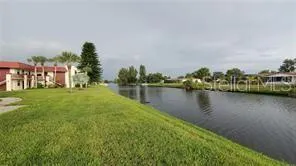 an aerial view of a houses with outdoor space and city view