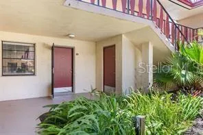 front view of a house with potted plants