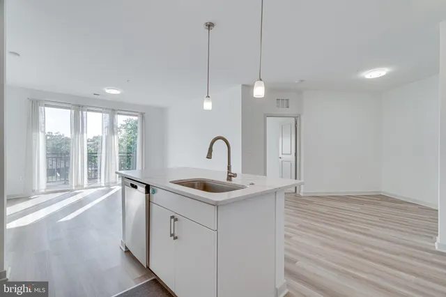 a bathroom with a sink and a window