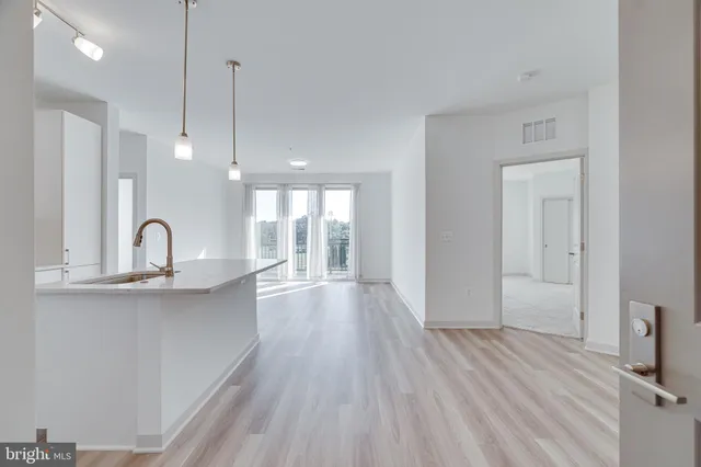 a view of a hallway with washer and dryer