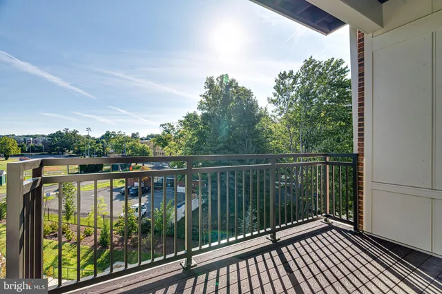 a view of a balcony with wooden floor