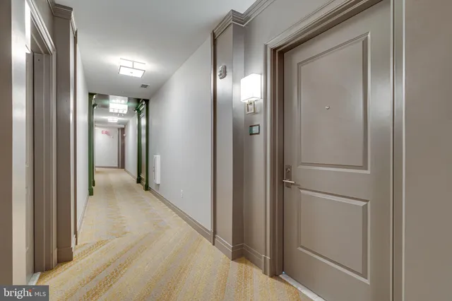 a view of a hall with wooden floor