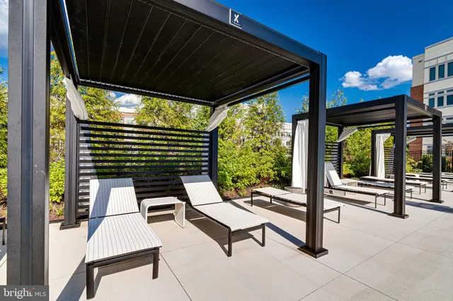 a view of a living room and a balcony