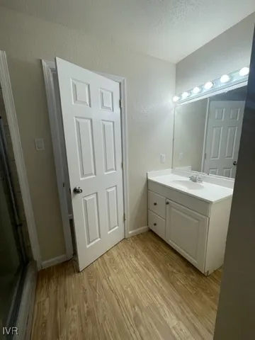 a bathroom with a sink a mirror and a vanity