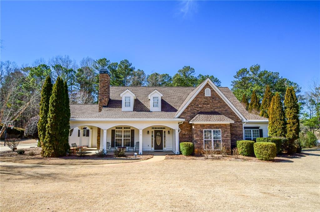 190 Chaparral Trace Tyrone, GA 30290 - Photo 1 of 1 a front view of a house with a yard and garage