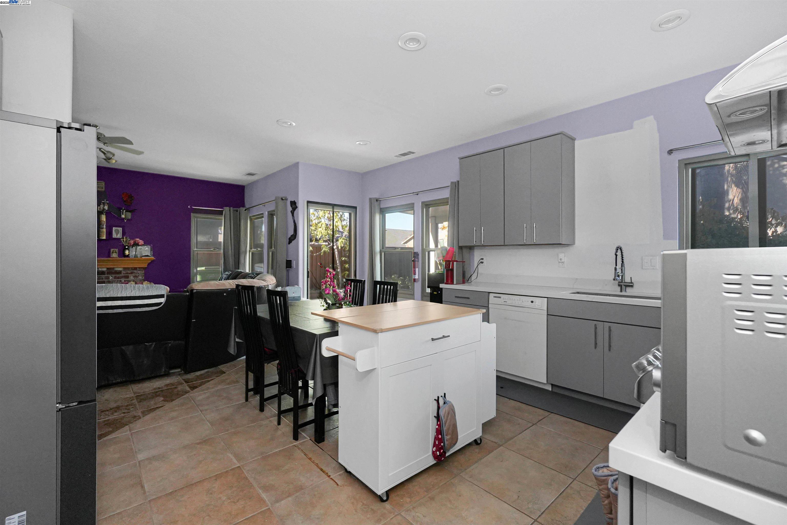 1445 Yorkshire Loop Tracy, CA 95376 - Photo 20 of 55 a kitchen that has a sink and a stove in it