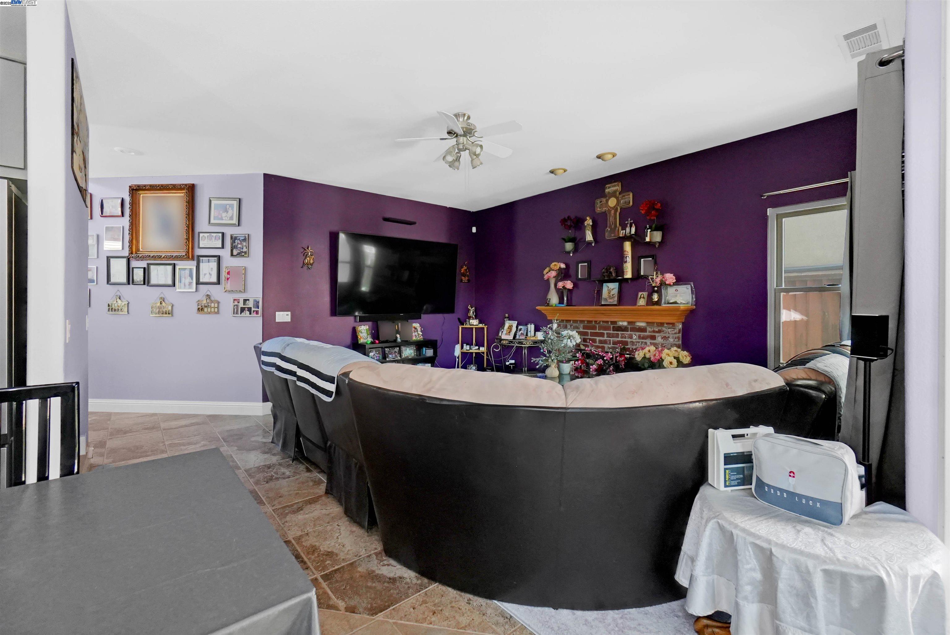1445 Yorkshire Loop Tracy, CA 95376 - Photo 24 of 55 a living room with furniture and a flat screen tv