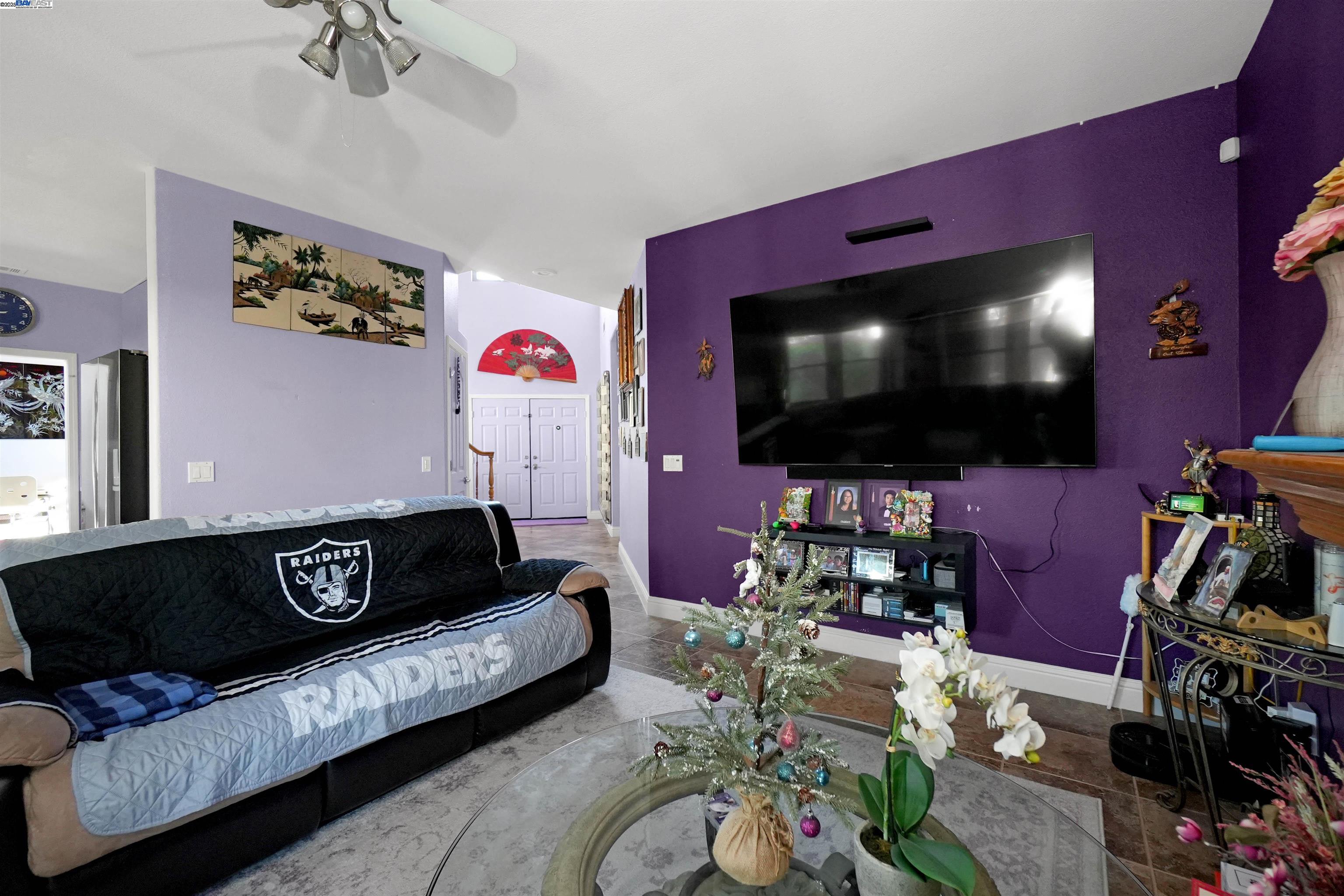 1445 Yorkshire Loop Tracy, CA 95376 - Photo 26 of 55 a living room with furniture and a flat screen tv