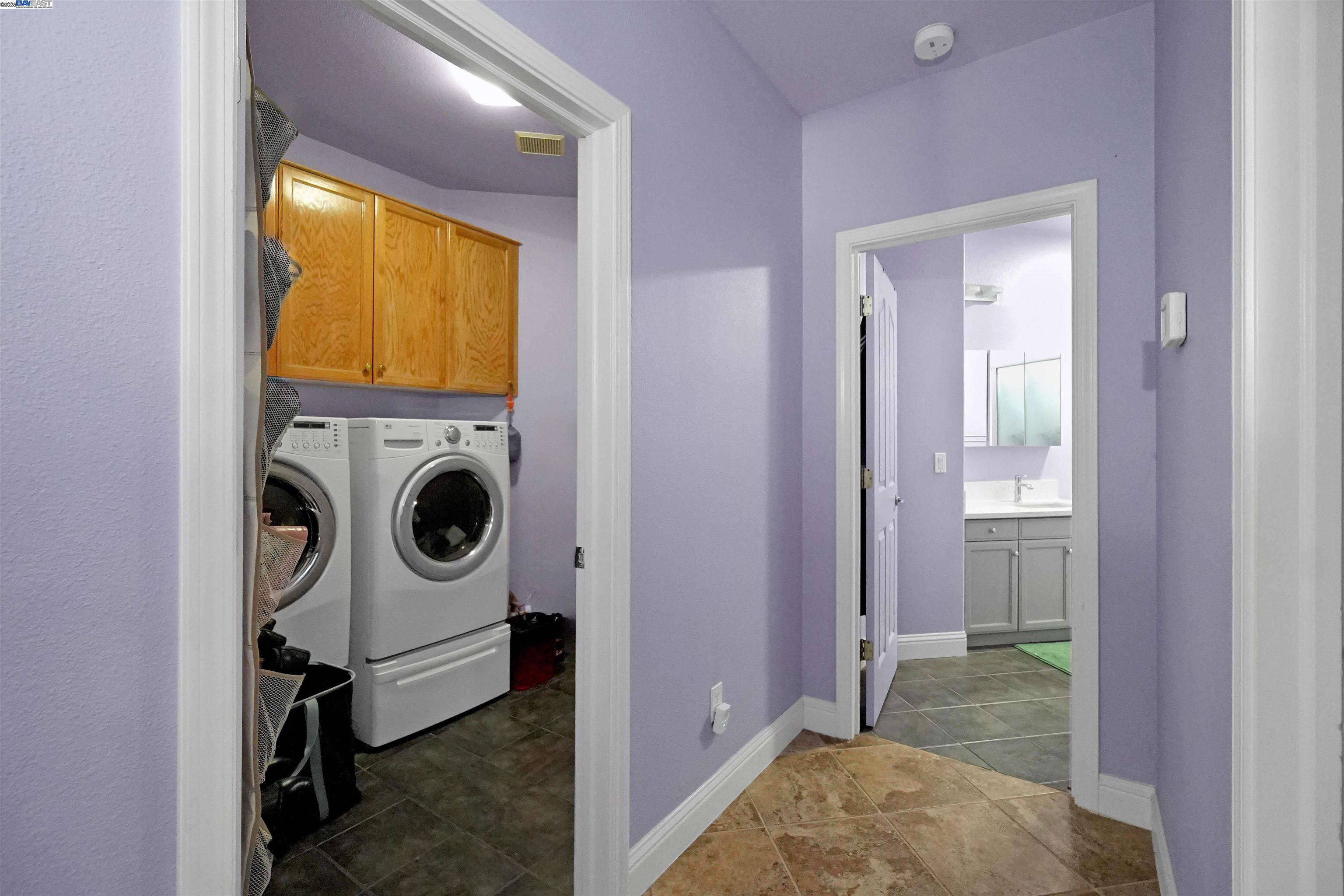 1445 Yorkshire Loop Tracy, CA 95376 - Photo 28 of 55 a view of a storage & utility room with washer and dryer