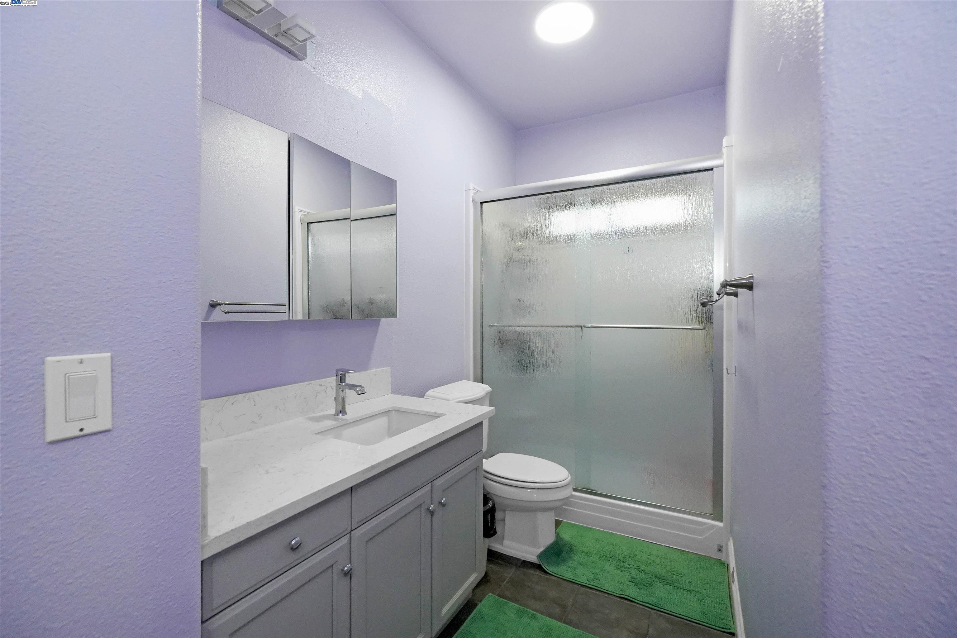 1445 Yorkshire Loop Tracy, CA 95376 - Photo 29 of 55 a bathroom with a sink a toilet and shower