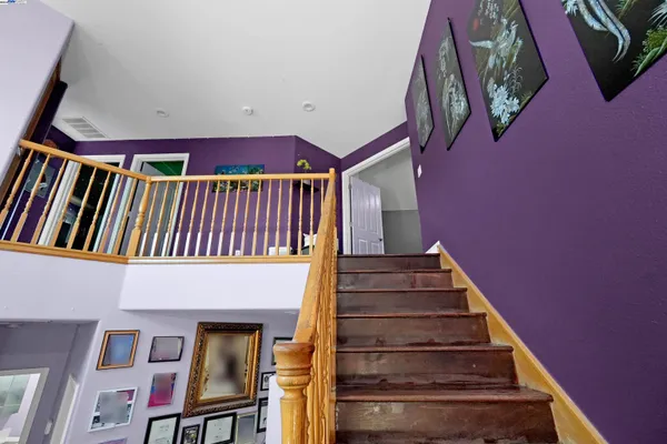 a view of a house with pool and sitting area